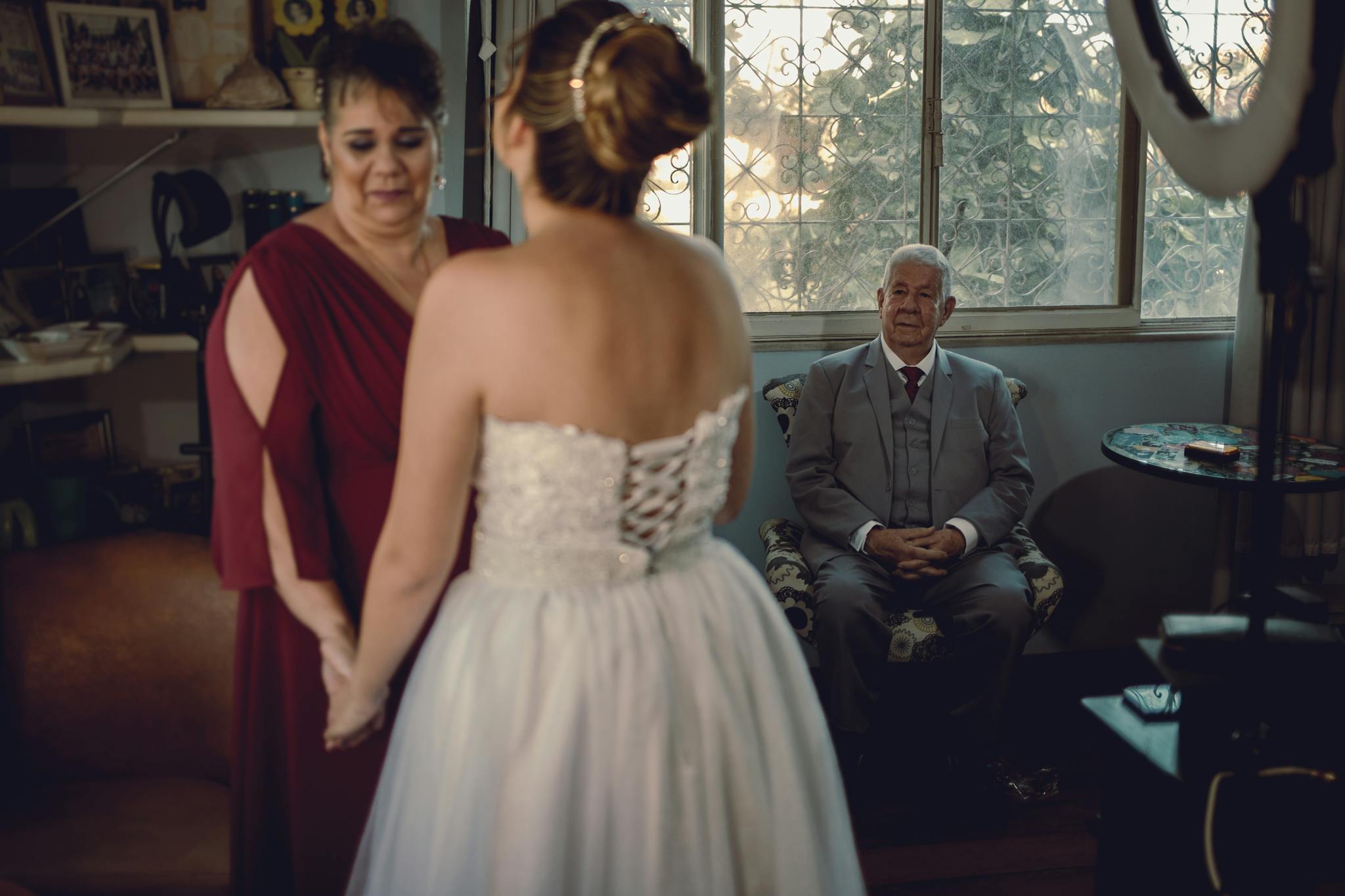 Bride shares a touching moment with family before wedding in Rio de Janeiro.